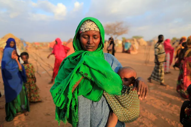 An internally displaced woman from drought hit area reacts after she complains about the lack of food at makeshift settlement area in Dollow, Somalia April 4, 2017. (Photo by Zohra Bensemra/Reuters)