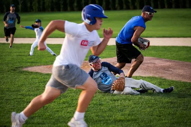 2020 Democratic U.S. presidential candidate and U.S. Senator Bernie Sanders dives for the ball during a baseball game between his staff, “The Revolutionaries”, and the Leaders Believers Achievers Foundation at the “Field of Dreams” movie site in Dyersville, Iowa, U.S., August 19, 2019. (Photo by Al Drago/Reuters)