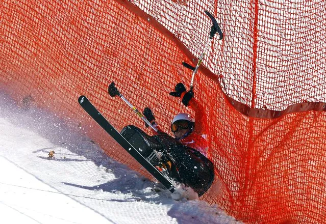 Wenjing Zhang of Team China crashes in the Para Alpine Skiing Women's Super Combined Super-G at Yanqing National Alpine Skiing Centre during day three of the Beijing 2022 Winter Paralympics on March 07, 2022 in Yanqing, China. (Photo by Gonzalo Fuentes/Reuters)