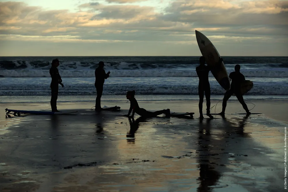 Surfers Brave The Cold To Enjoy Year Round Surfing