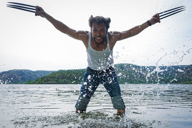 Ozer Tetik, who lives in Turkiye's Adana and resembles the character 'Wolverine' played by the famous actor Hugh Jackman is pictured, in Ankara, Turkiye on June 28, 2024. Tetik draws attention with his poses that look like movie scenes at his workplace and on the street. (Photo by Ahmet Serdar Eser/Anadolu via Getty Images)