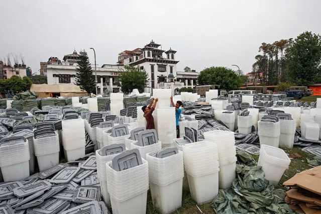 Workers unload the ballot boxes at the election commission in Kathmandu, Nepal, 21 April 2017. Nepal is scheduled to vote for the local level general elections on 14 May 2017, the first in 20 years. (Photo by Narendra Shrestha/EPA)