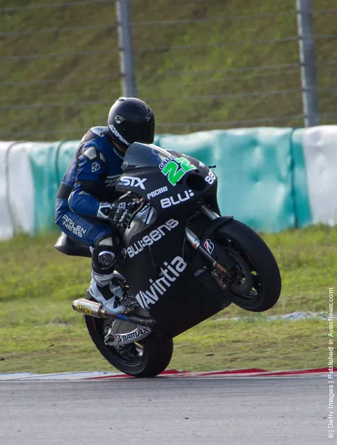 Ivan Silva of Spain and Avintia Racing MotoGP lifts the front wheel during the first day of MotoGP Testing at Sepang Circuit