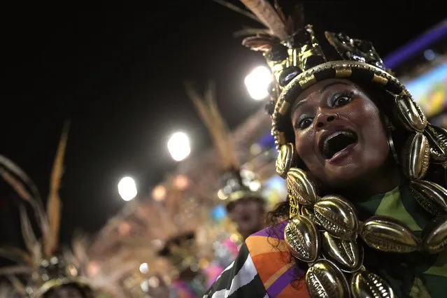 A performer from the Mangueira samba school parades during Carnival celebrations at the Sambadrome in Rio de Janeiro, Brazil, Friday, April 22, 2022. (AP Photo/Silvia Izquierdo)