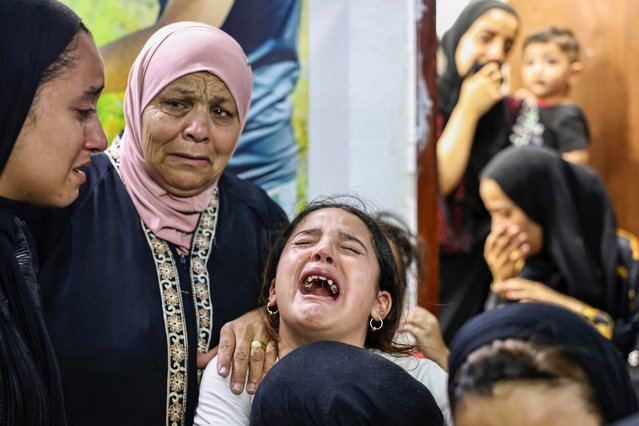 The sister of Ahmad Shaikh Khaleel, who was killed during an Israeli airstrike on the Balata refugee camp east of Nablus that killed two Palestinians early morning on August 15, 2024, reacts during funeral. An Israeli air strike on a refugee camp in the occupied West Bank killed two Palestinians on August 15 as Jewish worshippers visited a nearby disputed holy site, Palestinian sources and Israeli army said. (Photo by Zain Jaafar/AFP Photo)