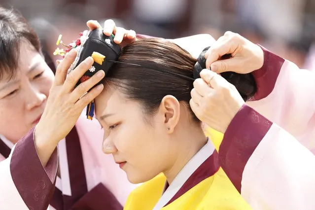 A twenty-year-old South Korean wearing traditional costumes participates in the 45th Coming of Age Day ceremony at Namsangol Hanok Village in Seoul, South Korea, 15 May 2017. (Photo by Jeon Heon-Kyun/EPA)