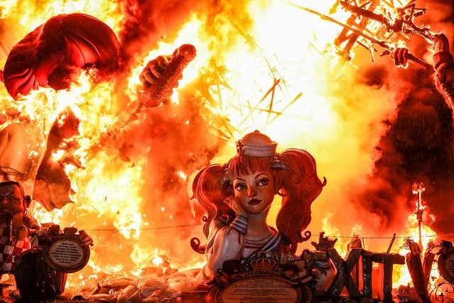 A falla, of a girl with pigtails and dressed as a sailor, is burned during the Crema, on 20 March, 2022 in Valencia, Valencian Community, Spain. The crema is the act of setting fire to the monuments of the Fallas, with which this festivity ends. The Valencian festival of Las Fallas, declared Intangible Heritage of Unesco since 2016, has returned after two years without being able to be celebrated as a result of the pandemic and a minimum schedule in September 2021 to burn the monuments of 2020. (Photo By Rober Solsona/Europa Press via Getty Images)
