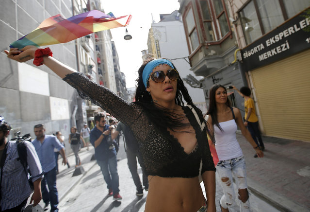 People protest against the ban on a gay pride march, off Istiklal Avenue, central Istanbul's main shopping road, Sunday, June 19, 2016. (Photo by Emrah Gurel/AP Photo)