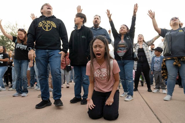 Congregants worship during the final stop of Sean Feucht’s Kingdom to the Capitol Tour at Wesley Bolin Memorial Plaza outside the Arizona State Capitol in Phoenix, Arizona, October 19, 2024. Traveling evangelical musician Sean Feucht, a Republican, has led a worship service at all 50 US state capitols and will perform in Washington, DC, next week. (Photo by Rebecca Noble/AFP Photo)