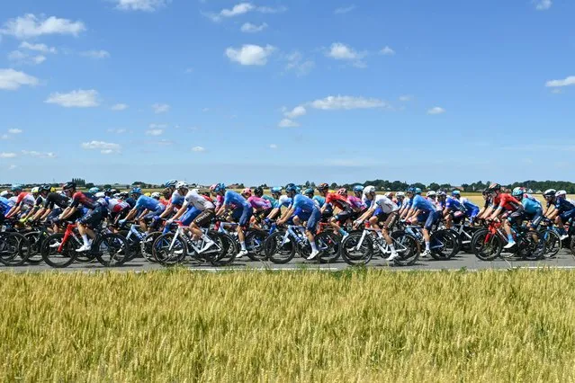 The pack of the riders pictured at the start of stage four of the Tour de France cycling race, a 171.5 km race from Dunkerque to Calais, France on Tuesday 05 July 2022. This year's Tour de France takes place from 01 to 24 July 2022. (Photo by Jasper Jacobs/Belga Mag/Belga via AFP Photo)