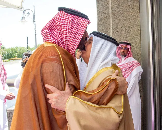 Saudi Crown Prince Mohammed bin Salman greets Bahrain's King Hamad bin Isa al-Khalifa in Jeddah, Saudi Arabia, July 16, 2022. (Photo by Saudi Press Agency/Handout via Reuters)