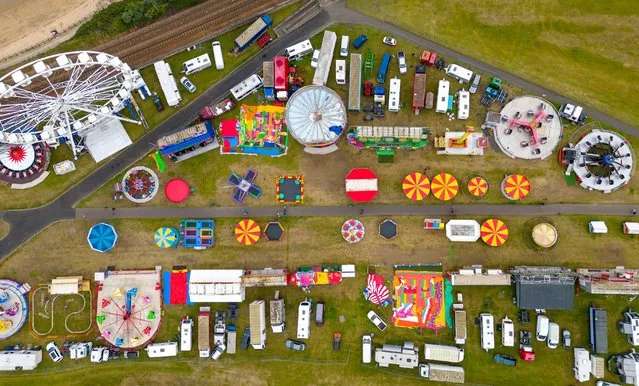 Looking down from a drone on a traditional summer funfair beside the beach at Burntisland in Fife, Scotland on July 3, 2022. (Photo by Iain Masterton/Alamy Live News)