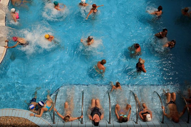 Bathers relax at the Lukacs Bath in Budapest, Hungary June 30, 2016. (Photo by Bernadett Szabo/Reuters)