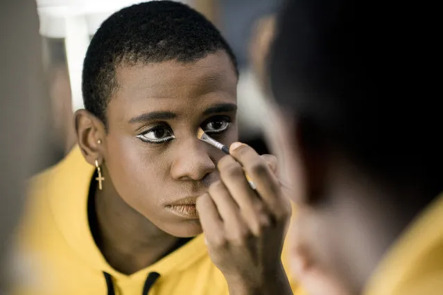 In this Tuesday, September 19, 2017 photo, ballet dancer Acaoa Theophilo puts on makeup before a dress rehearsal of Romeo and Juliet in Montevideo, Uruguay. Uruguay is a small country of 3.3 million people, but its ballet Director Julio Bocca has always said that he wants the local ballet company to be among the world’s top 10. (Photo by Matilde Campodonico/AP Photo)