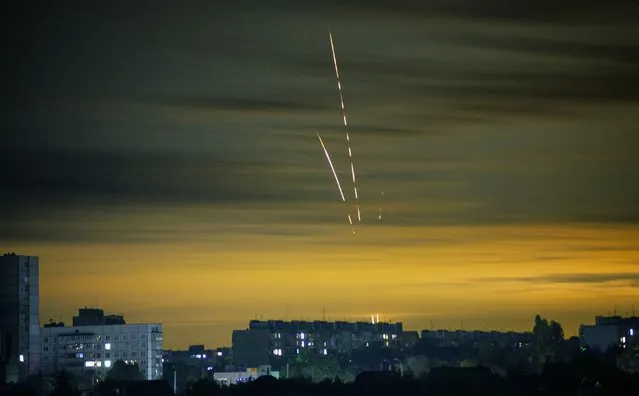 Russian rockets launched against Ukraine from Russia's Belgorod region are seen at dawn in Kharkiv, Ukraine, Wednesday, September 21, 2022. (Photo by Vadim Belikov/AP Photo)