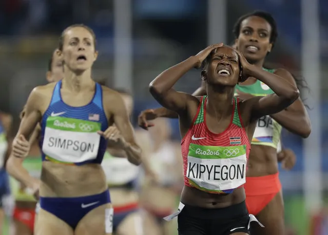 Kenya's Faith Chepngetich Kipyegon crosses the line to win the gold medal in the women's 1500-meter final during the athletics competitions of the 2016 Summer Olympics at the Olympic stadium in Rio de Janeiro, Brazil, Tuesday, August 16, 2016. (Photo by David J. Phillip/AP Photo)
