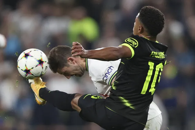 Tottenham's Ben Davies attempts to head the ball away from Sporting's Marcus Edwards during the Champions League group D soccer match between Tottenham Hotspur and Sporting CP at Tottenham Hotspur Stadium in London, Wednesday, October 26, 2022. (Photo by Ian Walton/AP Photo)