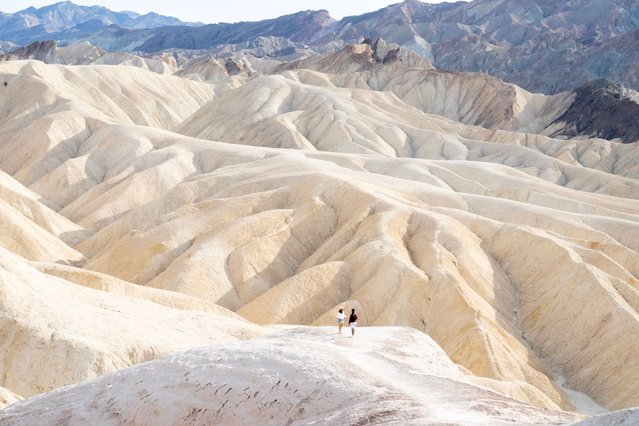 Visitors enjoy the spectacular landscape of the Death Valley National Park in California, 2024. The area is home to the United States’ lowest point, Badwater Basin, which lies at 282 feet below sea level. (Photo by Story Picture Agency)