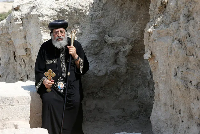 Pope Tawadros II, Pope of Alexandria and Patriarch of the See of St. Mark, prays during his visit to the Baptism Site on the Jordan River, where the baptism of Jesus Christ took place, September 5, 2016. (Photo by Muhammad Hamed/Reuters)