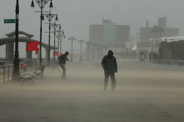 The Coney Island boardwalk stands mostly empty as Tropical Storm Isaias churns its way up the East Coast on on August 04, 2020 in New York City. The storm, which regained hurricane strength Monday night, brought heavy rainfall, lightning, strong winds and flooding to the New York City area on Tuesday afternoon. (Photo by Spencer Platt/Getty Images)
