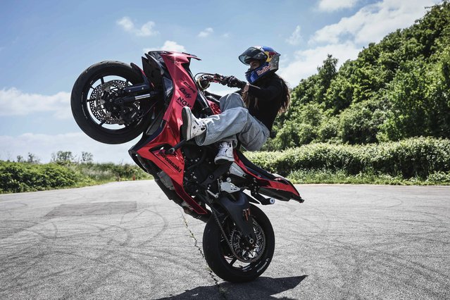 French world champion stuntwoman, Sarah Lezito, performs a wheelstand on her motorbike Kawasaki Ninja ZX-6R, on her private track near Epernay eastern France, on May 22, 2025. (Photo by Thibaud Moritz/AFP Photo)
