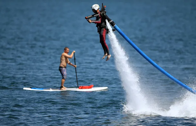 U.S. military veteran Joshua Alves shoots out of the ocean on a water jetboard as part of an event by Warrior Passion, a charity that helps adjusting U.S. veterans, and Jetpack America to assist veterans in overcoming their challenges through shared adventure and fun in San Diego, California, U.S. September 14, 2016. (Photo by Mike Blake/Reuters)