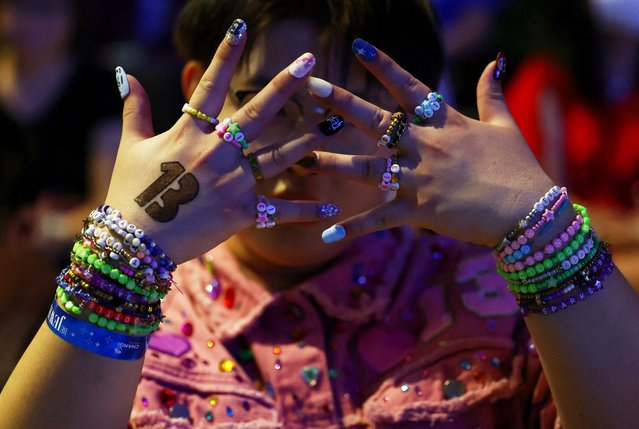 Luke, 22, from Shandong, China shows his bracelets amongst Taylor Swift fans, or Swifties, during a sing-a-long ahead of Swift’s Eras Tour concert, at Jewel Changi Airport in Singapore on March 1, 2024. (Photo by Edgar Su/Reuters)