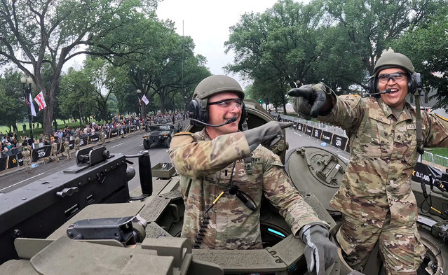 First Lieutenant Zachary Buher and Staff Sergeant Cesar Lua, members of the U.S. Army's Charlie Company, 2nd Battalion, 5th Cavalry Regiment, 1st Armored Brigade Combat Team, 1st Cavalry Division operate a M1A2 SEP V3 tank during the Army's 250th Birthday parade in Washington, D.C., on June 14, 2025. (Photo by Brian Snyder/Reuters)