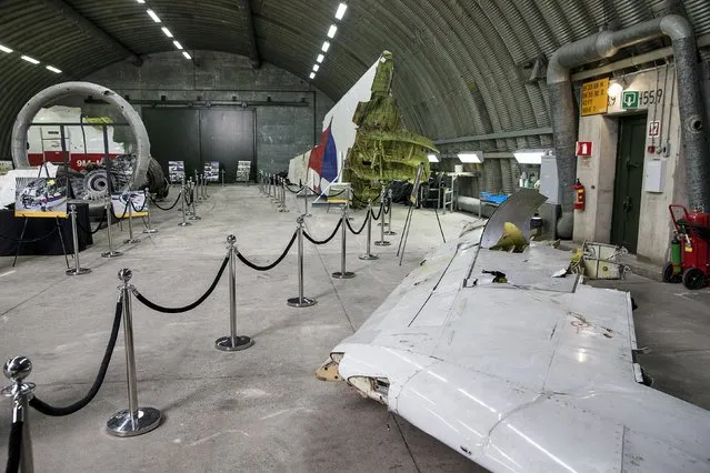 Wreckage of the MH17 airplane is seen after the presentation of the final report into the crash of July 2014 of Malaysia Airlines flight MH17 over Ukraine, in Gilze Rijen, the Netherlands, October 13, 2015. (Photo by Michael Kooren/Reuters)