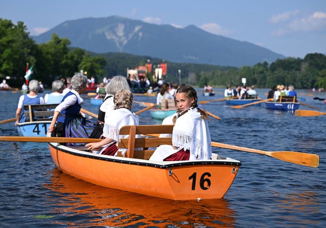 Believers take part in the traditional Bavarian Corpus Christi boat procession on Lake Staffelsee, in Seehausen am Staffelsee, near Murnau, Germany, on June 19, 2025. (Photo by Angelika Warmuth/Reuters)