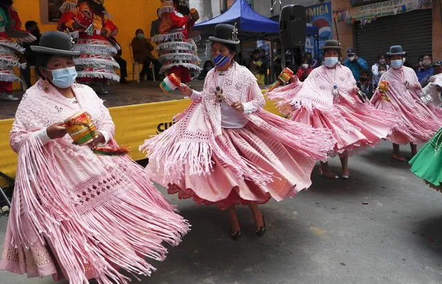 Women perform the “Morenada” dance at an exhibit of folk costumes during the partial lifting of restrictions amid the COVID -19 pandemic in La Paz, Bolivia, Friday, October 2, 2020. (Photo by Juan Karita/AP Photo)