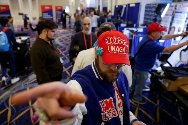 Workers and exhibitors prepare for the Conservative Political Action Conference (CPAC) gathering, whose list of speakers over the weekend will include former President Donald Trump, near Washington in National Harbor, Maryland on March 1, 2023. (Photo by Jonathan Ernst/Reuters)