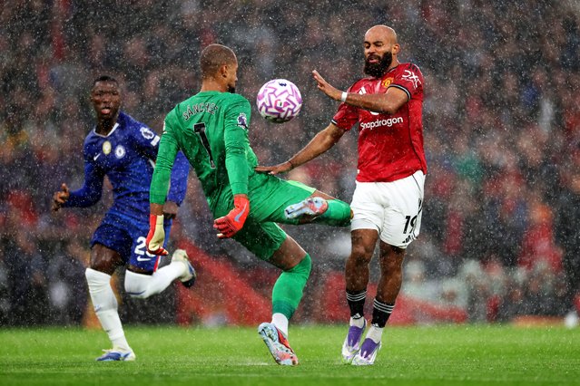 Robert Sanchez of Chelsea fouls Bryan Mbeumo of Manchester United resulting in a red card and sending off during the Premier League match between Manchester United and Chelsea at Old Trafford on September 20, 2025 in Manchester, England. (Photo by Marc Atkins/Getty Images)