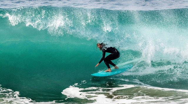 A surfer rides a wave at the Wedge in Newport Beach, Calif., Monday, September 29, 2025. (Photo by Paul Bersebach/The Orange County Register via AP Photo)