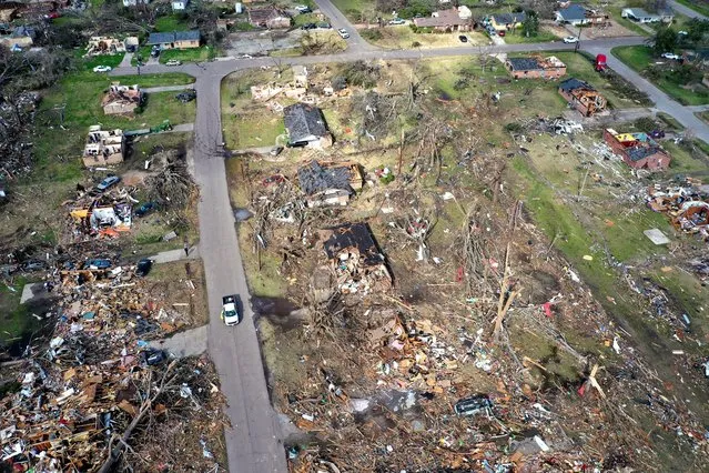 In an aerial view, piles of debris remain where homes once stood before Friday's EF-4 tornado on March 26, 2023 in Rolling Fork, Mississippi. At least 26 people died when the tornado ripped through the small town and other nearby communities. (Photo by Scott Olson/Getty Images)