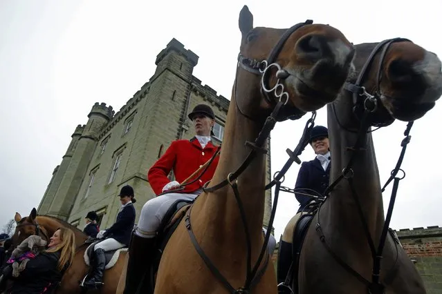 Members of the Old Surrey Burstow and West Kent Hunt gather at Chiddingstone Castle for the annual Boxing Day hunt in Chiddingstone, south east England December 26, 2014. (Photo by Luke MacGregor/Reuters)