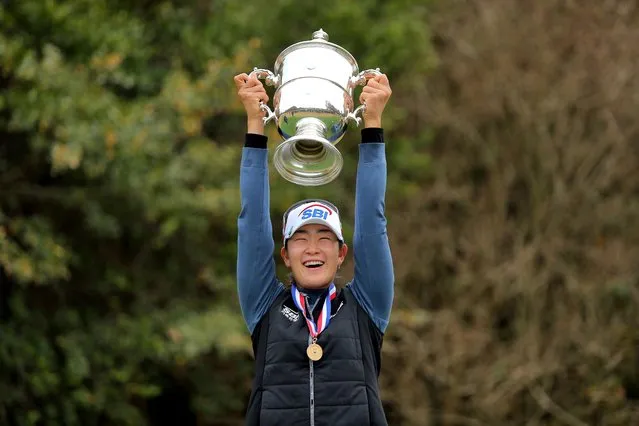 A Lim Kim hoists the championship trophy after winning the U.S. Women's Open golf tournament at Champions Golf Club in Houston, Texas on December 14, 2020. (Photo by Erik Williams/USA TODAY Sports)