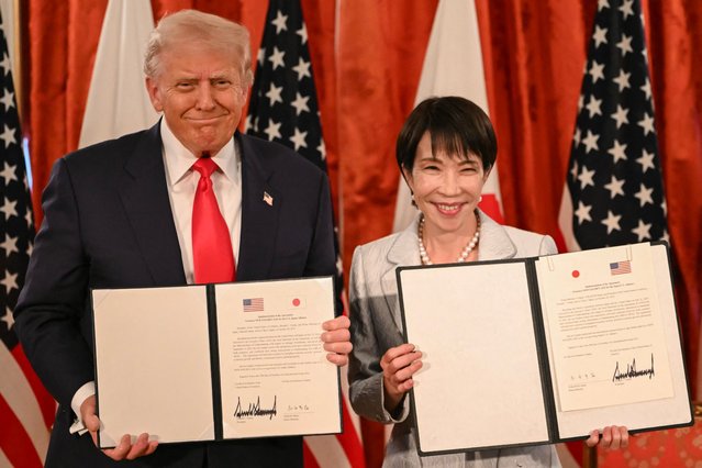 Japan's Prime Minister Sanae Takaichi (R) and US President Donald Trump attend a signing ceremony after a Japan-US Summit at the Akasaka State Guest House in Tokyo on October 28, 2025. (Photo by Andrew Caballero-Reynolds/AFP Photo)