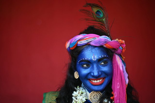 A college student dressed in the guise of Hindu deity Krishna, ahead of Janmashtami festival, in Chennai, India on August 23, 2024. (Photo by R.Satish Babu/AFP Photo)