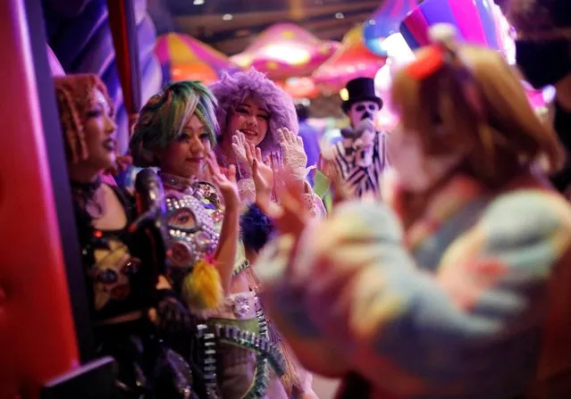Staff members of Kawaii Monster Cafe called “Monster Girls” send off guests before the cafe ends its five-year run operation on the day, amid the coronavirus disease (COVID-19) outbreak, in Tokyo,  Japan on January 31, 2021. (Photo by Issei Kato/Reuters)