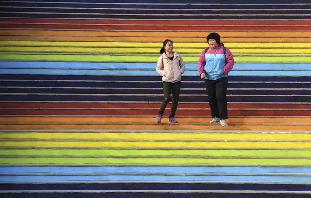 Students walk down a flight of stairs outside a dining hall at the campus of North China University of Water Resources and Electric Power in Zhengzhou, Henan province, January 17, 2015. (Photo by Reuters/Stringer)