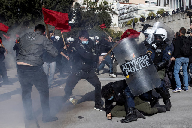 Greek university students clash with riot police during a demonstration against government plans to set up university police, amid the coronavirus disease (COVID-19) pandemic, in Athens, Greece, February 10, 2021. (Photo by Alkis Konstantinidis/Reuters)