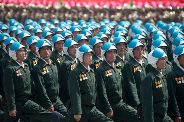 North Korean soldiers march during a military parade past Kim Il-Sung square marking the 60th anniversary of the Korean war armistice in Pyongyang on July 27, 2013.  North Korea mounted its largest ever military parade on July 27 to mark the 60th anniversary of the armistice that ended fighting in the Korean War, displaying its long-range missiles at a ceremony presided over by leader Kim Jong-Un. (Photo by Ed Jones/AFP Photo)