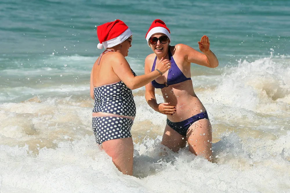 Santas Hit the Surf and Sand