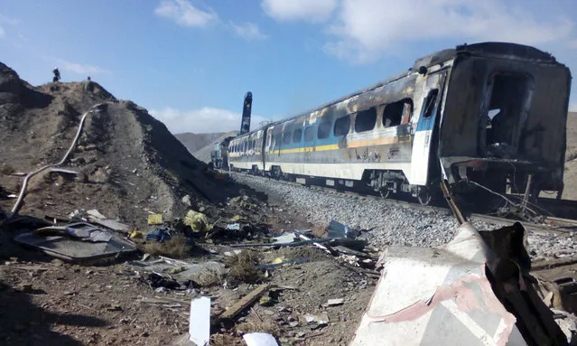 This picture released by Iranian Fars News Agency shows the scene of two trains collision about 150 miles (250 kilometers) east of the capital Tehran, Iran, Friday, November 25, 2016. An Iranian official has told state TV that the death toll from a train collision in the country's north has increased to 31. The provincial governor, Mohammad Reza Khabbaz, says that so far 31 bodies have been found at the site of the crash on Friday morning. (Photo by Saeed Esmaeilpour, Fars News Agency via AP Photo)