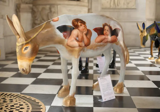 Artist painted donkey statues are displayed in the “Caravan” exhibition on August 30, 2013 in London, England. (Photo by Peter Macdiarmid/Getty Images)