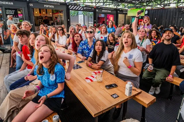 Fans in the Boxpark Shoreditch to watch the Lionesses in the the England v Australia, FIFA World Cup semi final in London, UK on August 16, 2023. (Photo by Guy Bell/Alamy Live News)