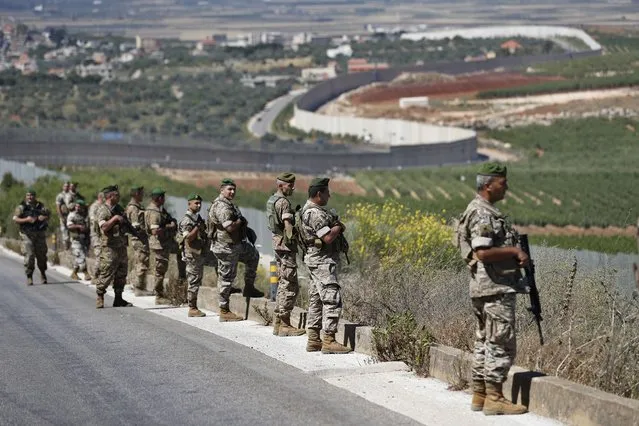 Lebanese army soldiers deploy at the Lebanese side of the Lebanese-Israeli border in the southern village of Kfar Kila, Lebanon, Saturday, May 15, 2021. (Photo by Hussein Malla/AP Photo)