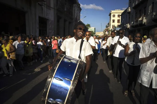 Musicians perform during a procession honoring Cuba's patron saint, the Virgin of Charity of Cobre, on her feast day in Havana, Friday, September 8, 2023. (Photo by Ramon Espinosa/AP Photo)