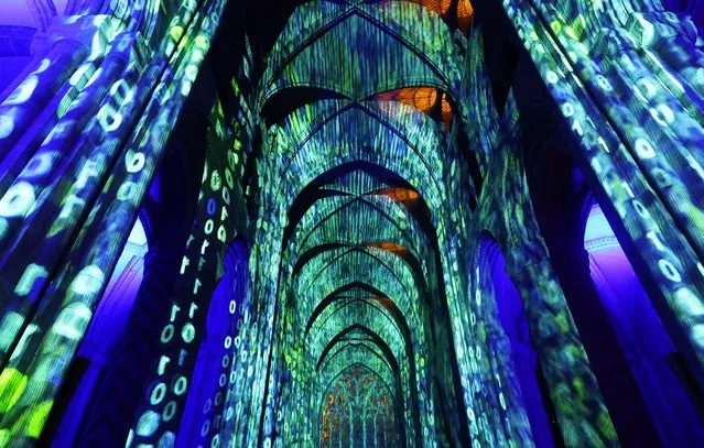 Art installation titled “Science” by Luxmuralis is pictured on display inside Durham Cathedral in Durham, Britain on October 10, 2023. (Photo by Lee Smith/Reuters)